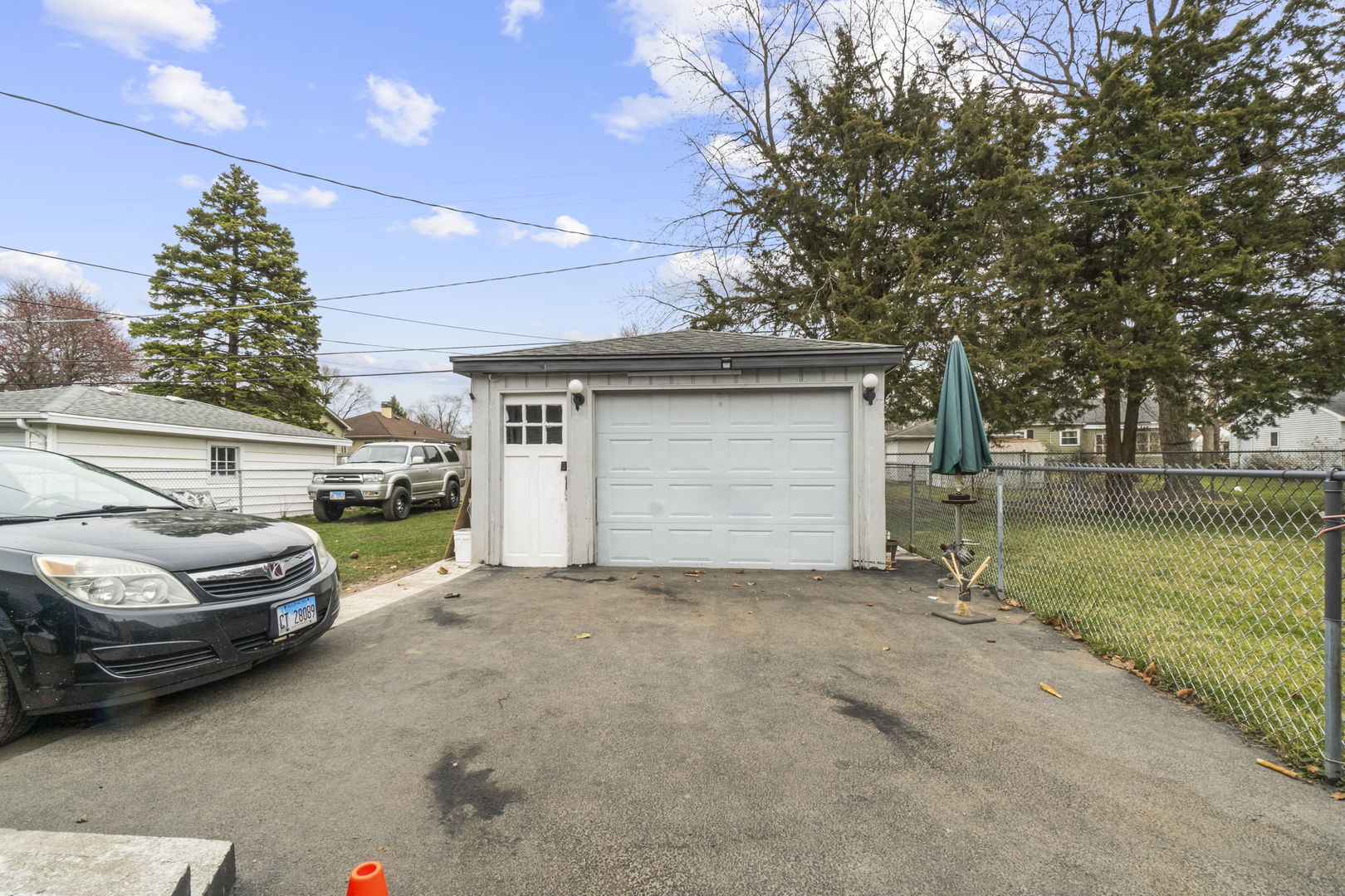 208 South Reed Street Joliet, IL 60436 - Photo 16 of 18 a view of a car parked in garage