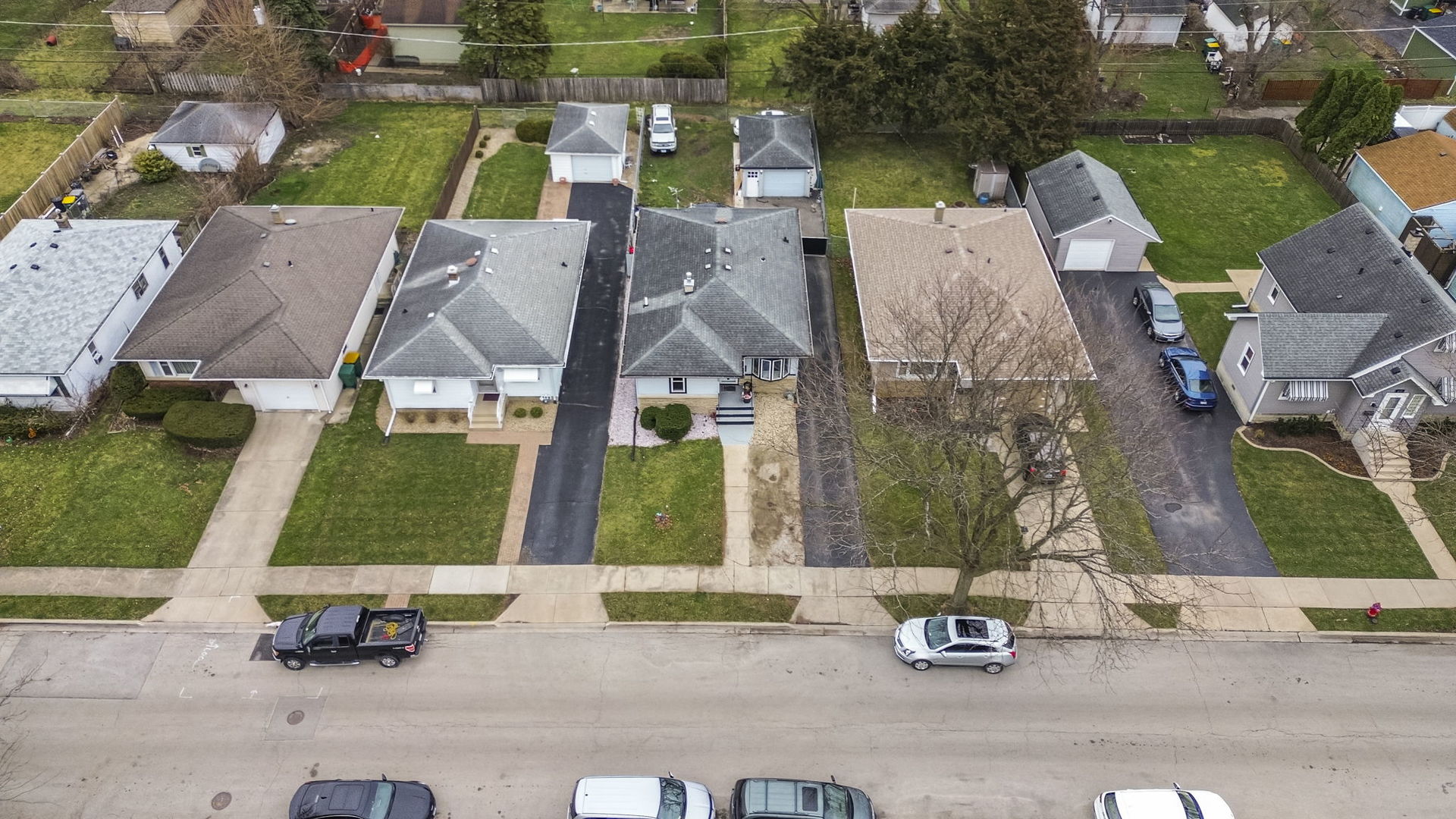 208 South Reed Street Joliet, IL 60436 - Photo 18 of 18 an aerial view of multiple houses with a yard