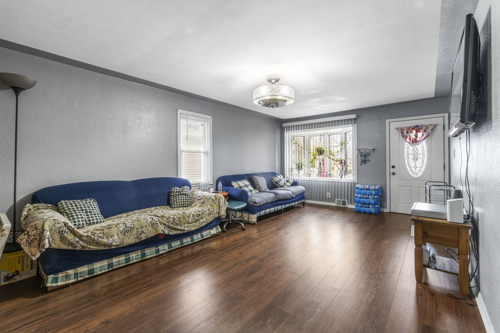 208 South Reed Street Joliet, IL 60436 - Photo 5 of 18 a living room with furniture and a flat screen tv