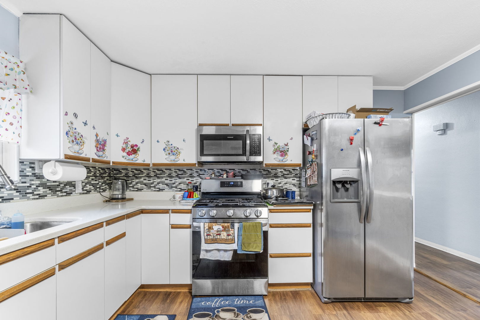 208 South Reed Street Joliet, IL 60436 - Photo 6 of 18 a kitchen with stainless steel appliances granite countertop a refrigerator and a sink