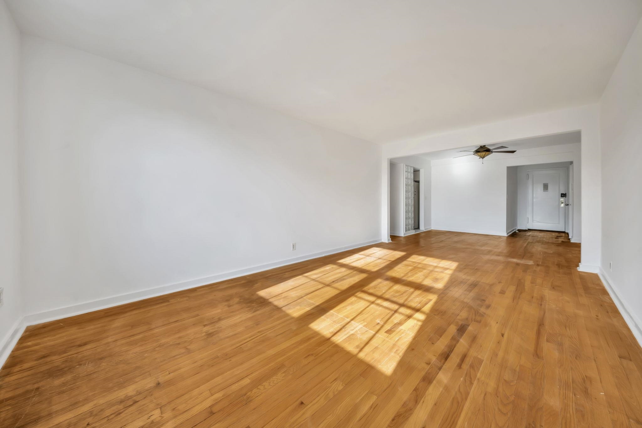 8450 Boulevard East, Unit 4F North Bergen, NJ 07047 - Photo 11 of 22 a bedroom with a bed and a wooden floor
