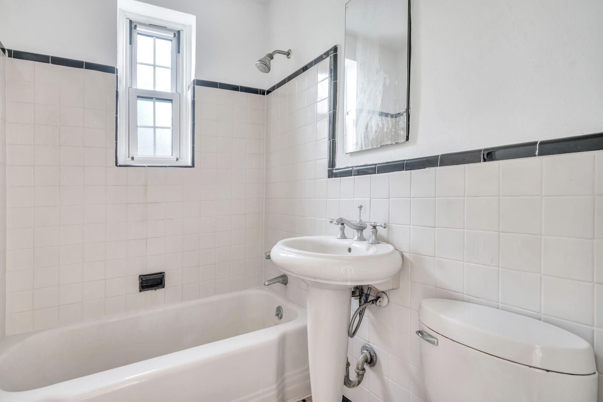 8450 Boulevard East, Unit 4F North Bergen, NJ 07047 - Photo 13 of 22 a bathroom with a sink a toilet and a bathtub