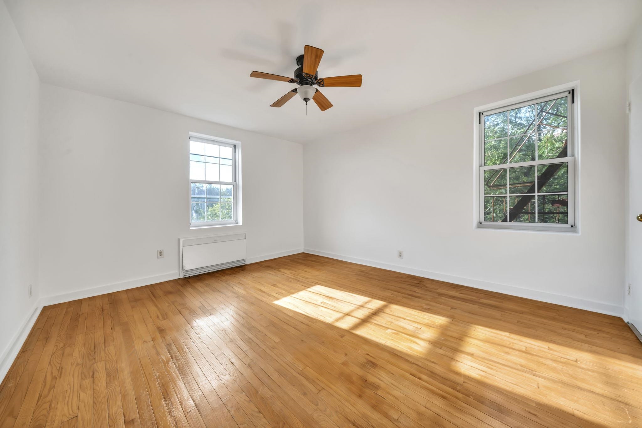 8450 Boulevard East, Unit 4F North Bergen, NJ 07047 - Photo 14 of 22 a view of empty room with wooden floor and fan