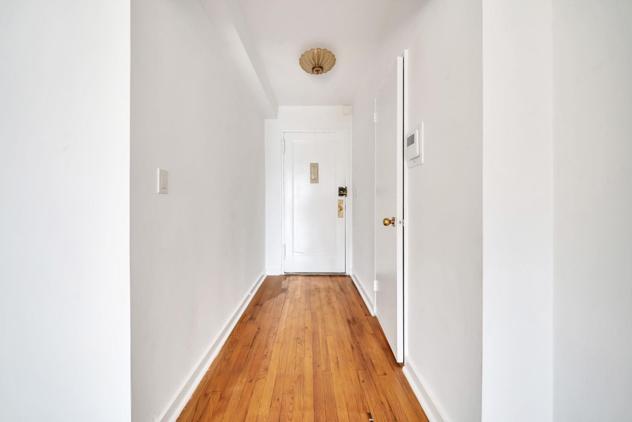 8450 Boulevard East, Unit 4F North Bergen, NJ 07047 - Photo 5 of 22 a view of a hallway with wooden floor