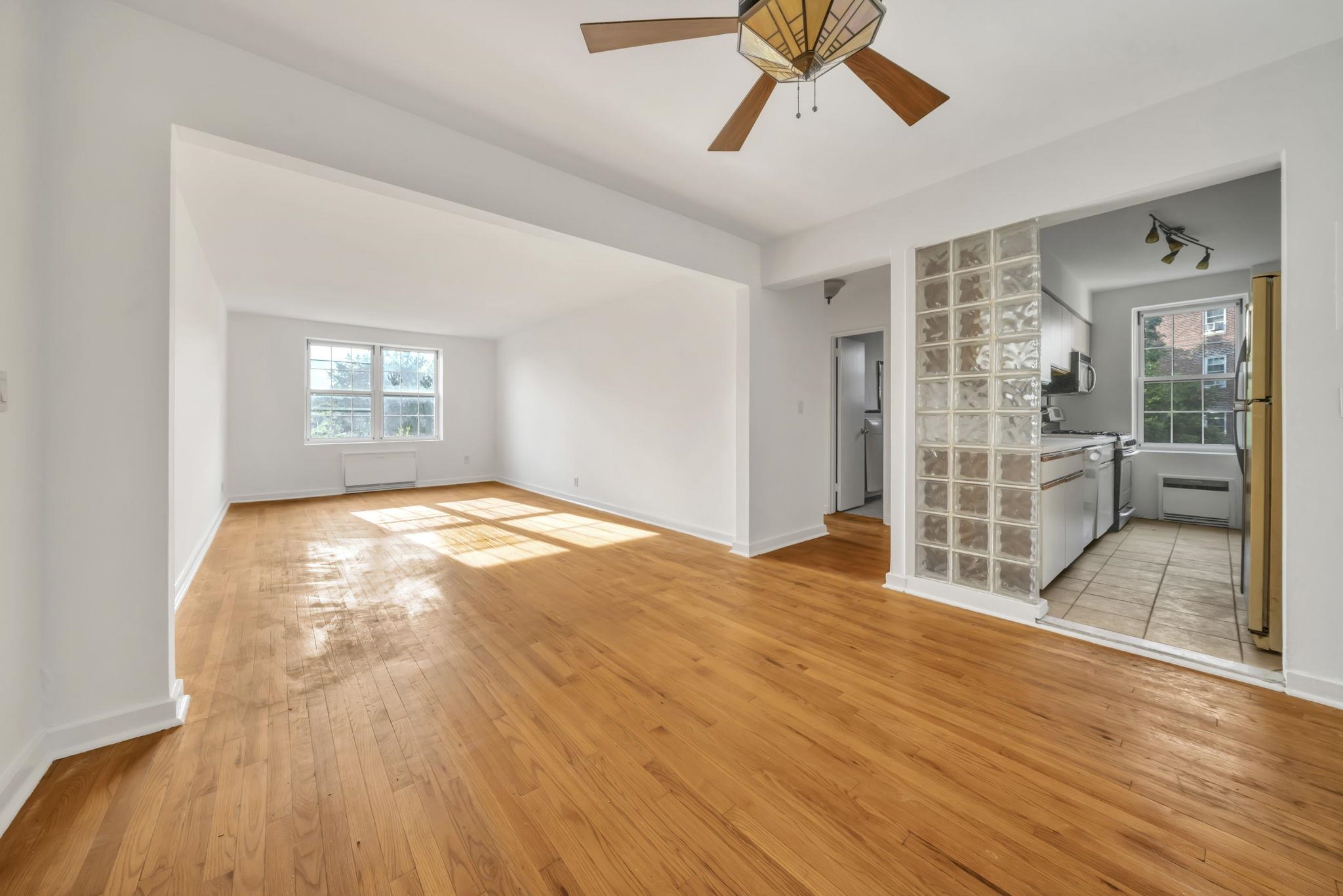 8450 Boulevard East, Unit 4F North Bergen, NJ 07047 - Photo 6 of 22 a view of empty room with wooden floor and fan