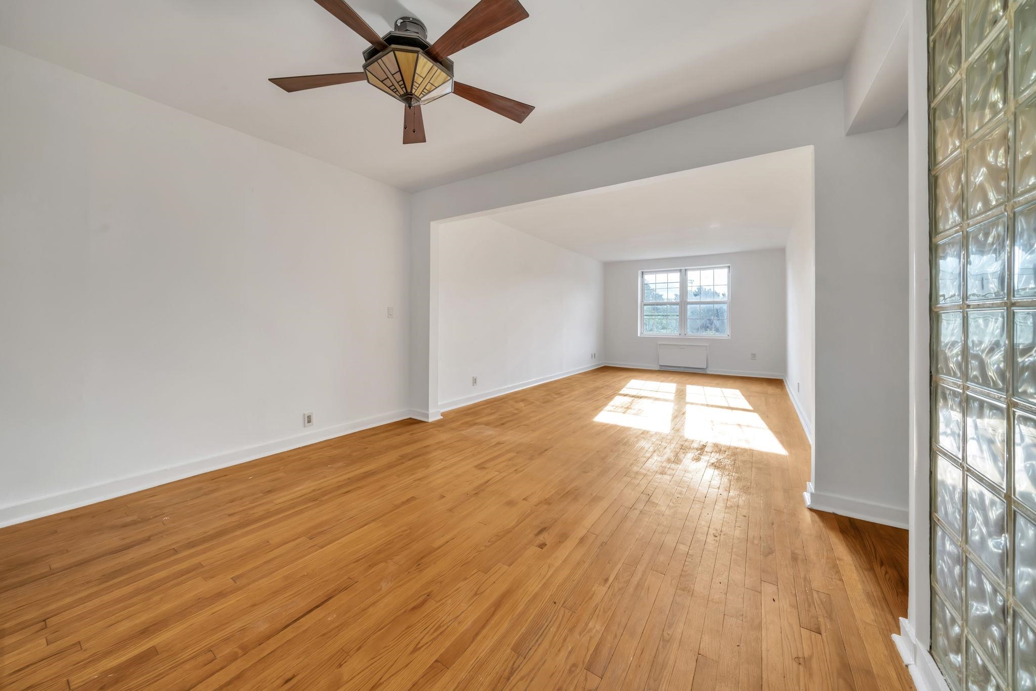8450 Boulevard East, Unit 4F North Bergen, NJ 07047 - Photo 8 of 22 a view of empty room with wooden floor and fan