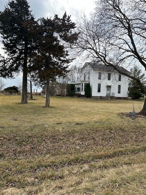 2665 East Sherrill Road Minooka, IL 60447 - Photo 1 of 23 a view of a yard with a house and large trees