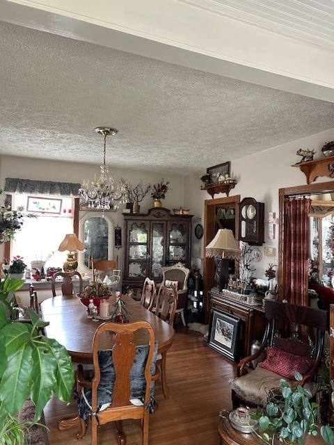 2665 East Sherrill Road Minooka, IL 60447 - Photo 12 of 23 a living room with lots of furniture and chandelier