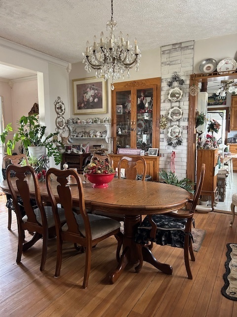 2665 East Sherrill Road Minooka, IL 60447 - Photo 14 of 23 a view of a dining room with furniture and chandelier