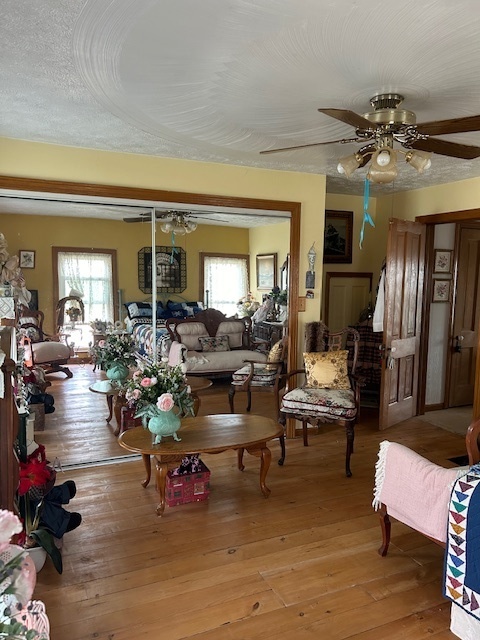 2665 East Sherrill Road Minooka, IL 60447 - Photo 22 of 23 a living room with furniture and wooden floor