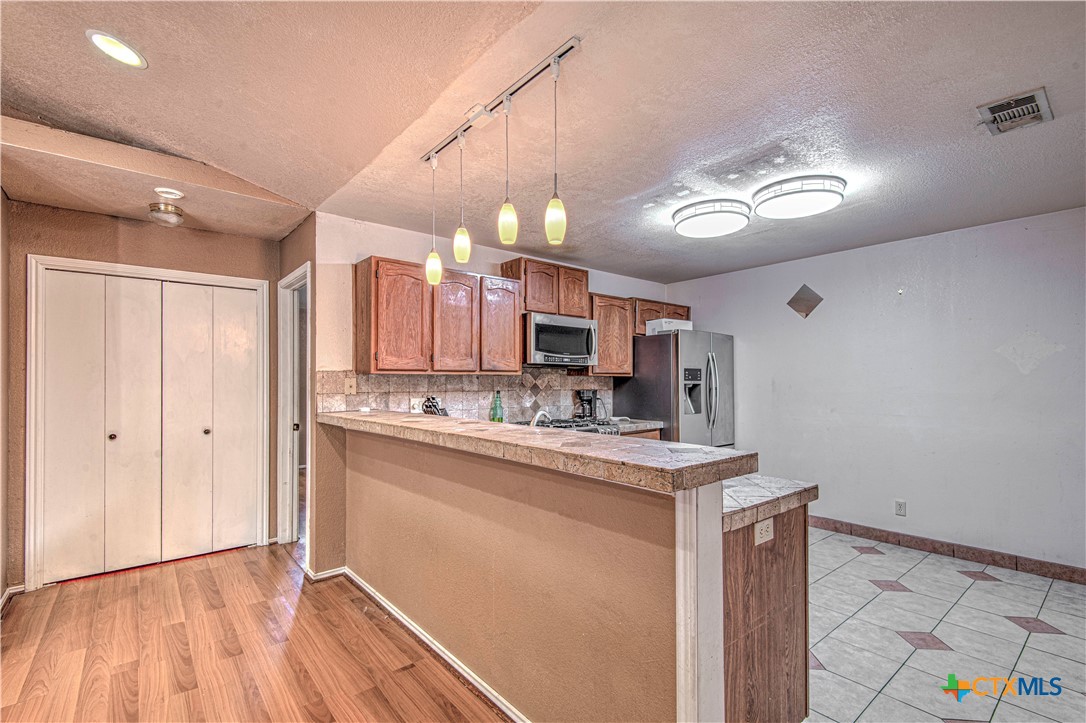 4802 Stone Ridge Drive Temple, TX 76502 - Photo 11 of 27 LAMINATE WOOD LIKE FLOORS