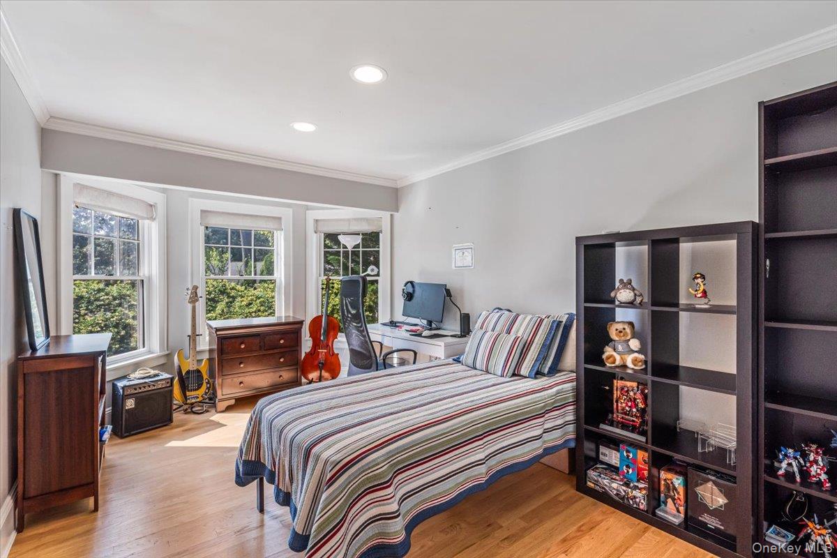 130 Sands Point Road Sands Point, NY 11050 - Photo 18 of 26 Bedroom with crown molding, wood finished floors, and recessed lighting