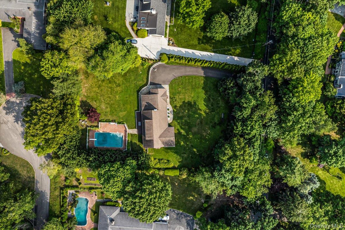 130 Sands Point Road Sands Point, NY 11050 - Photo 3 of 26 Aerial view of property and surrounding area featuring a pool area