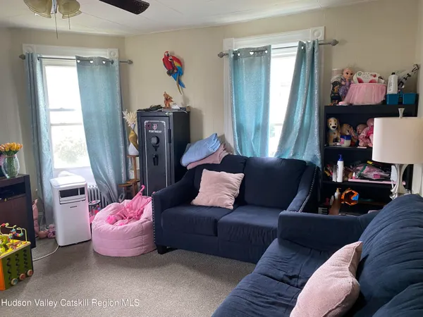 a living room with furniture and a window