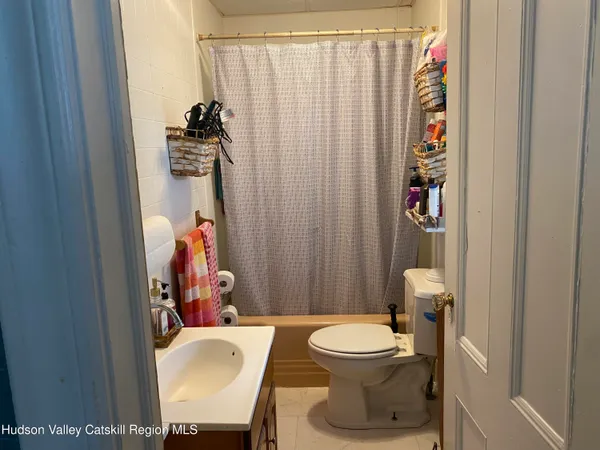 a kitchen with a kitchen island a stove a table and chairs in it