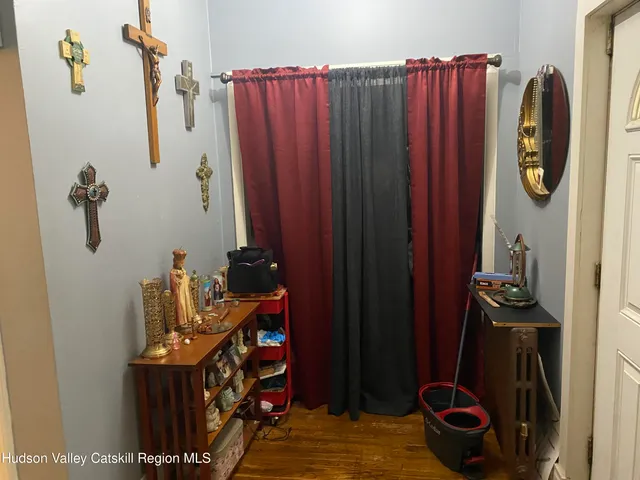 a room with furniture and a potted plant