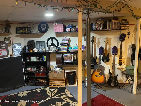 a living room with lots of furniture and a rug