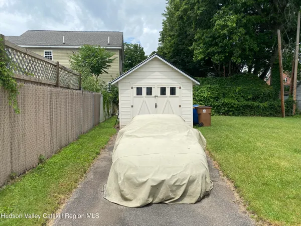 a view of a house with yard and a garden
