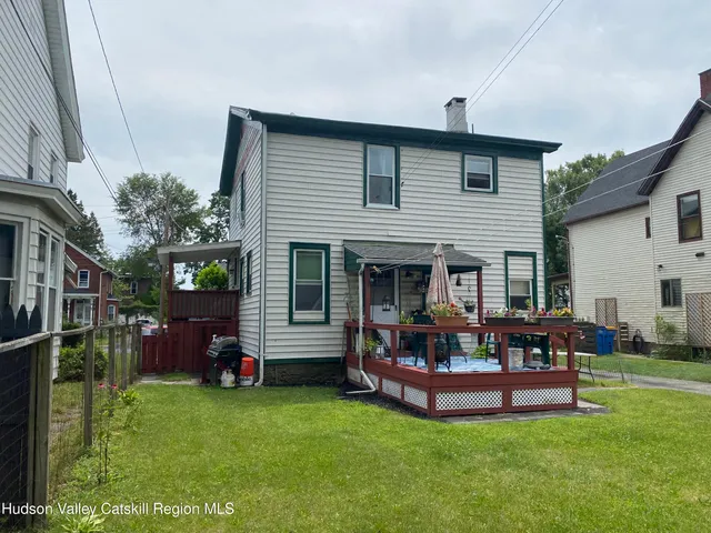 a front view of house with a garden and patio