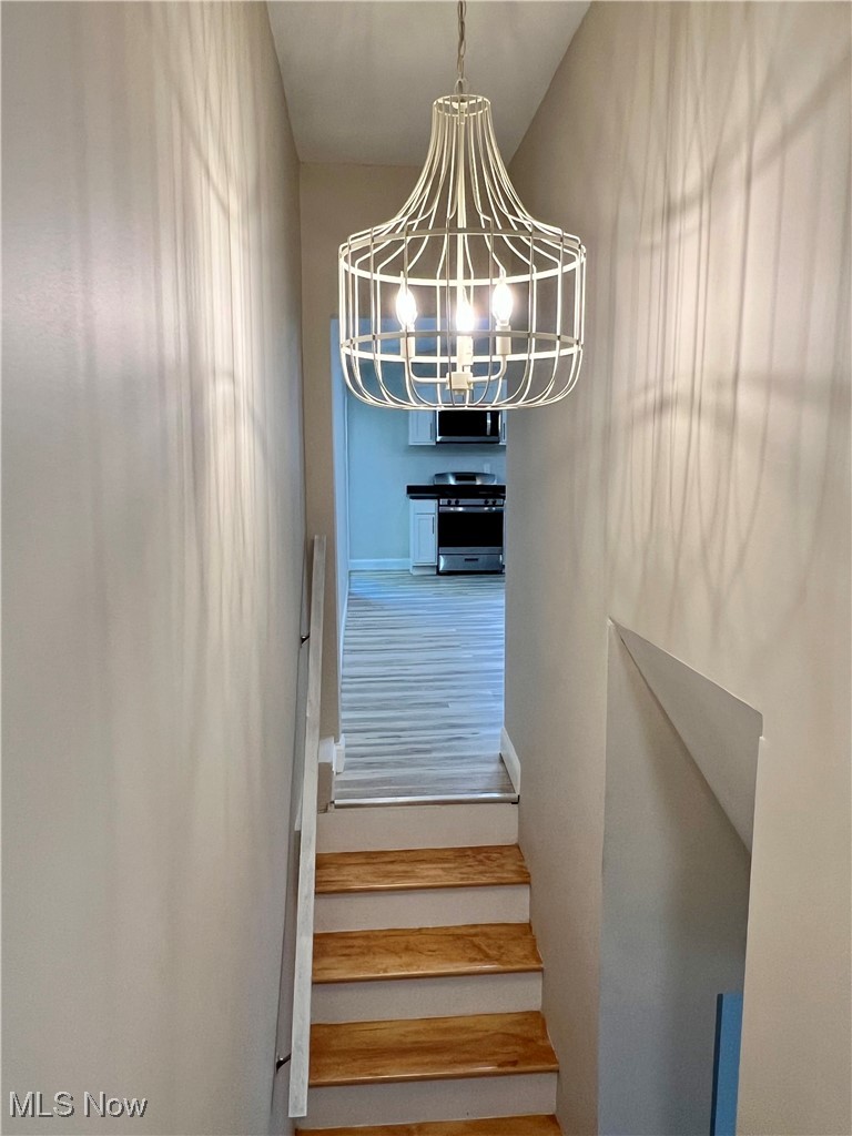 2972 North Turkeyfoot Road Akron, OH 44319 - Photo 13 of 32 Staircase featuring baseboards