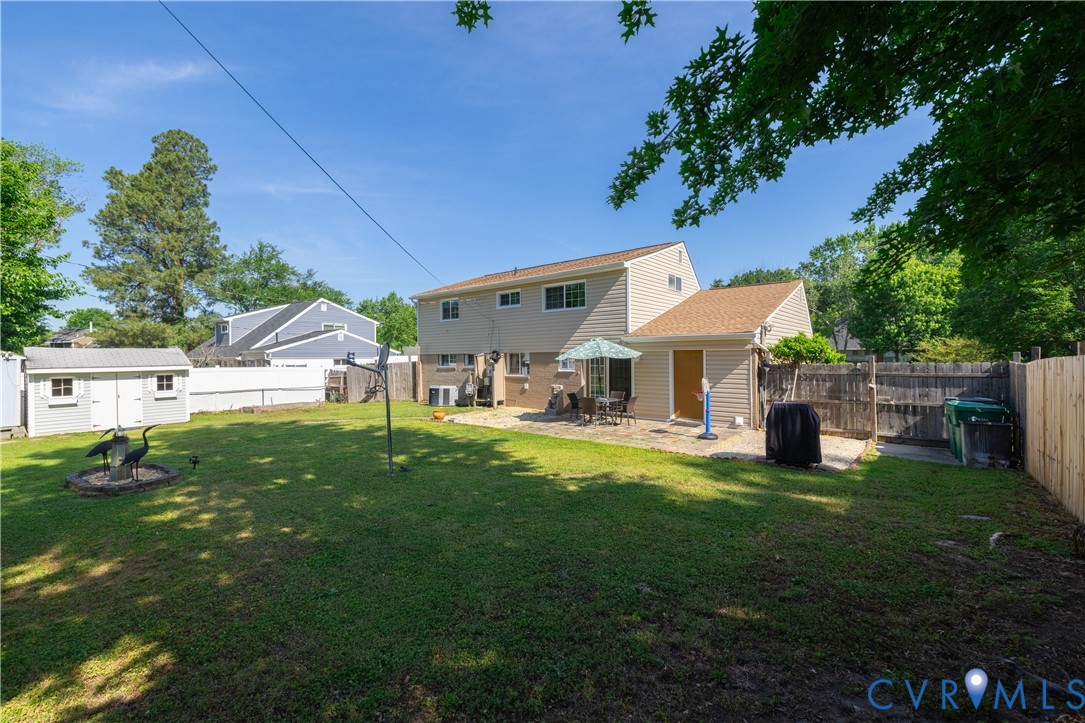 9217 Fisk Road Richmond, VA 23229 - Photo 32 of 39 a view of a house with backyard porch and sitting area