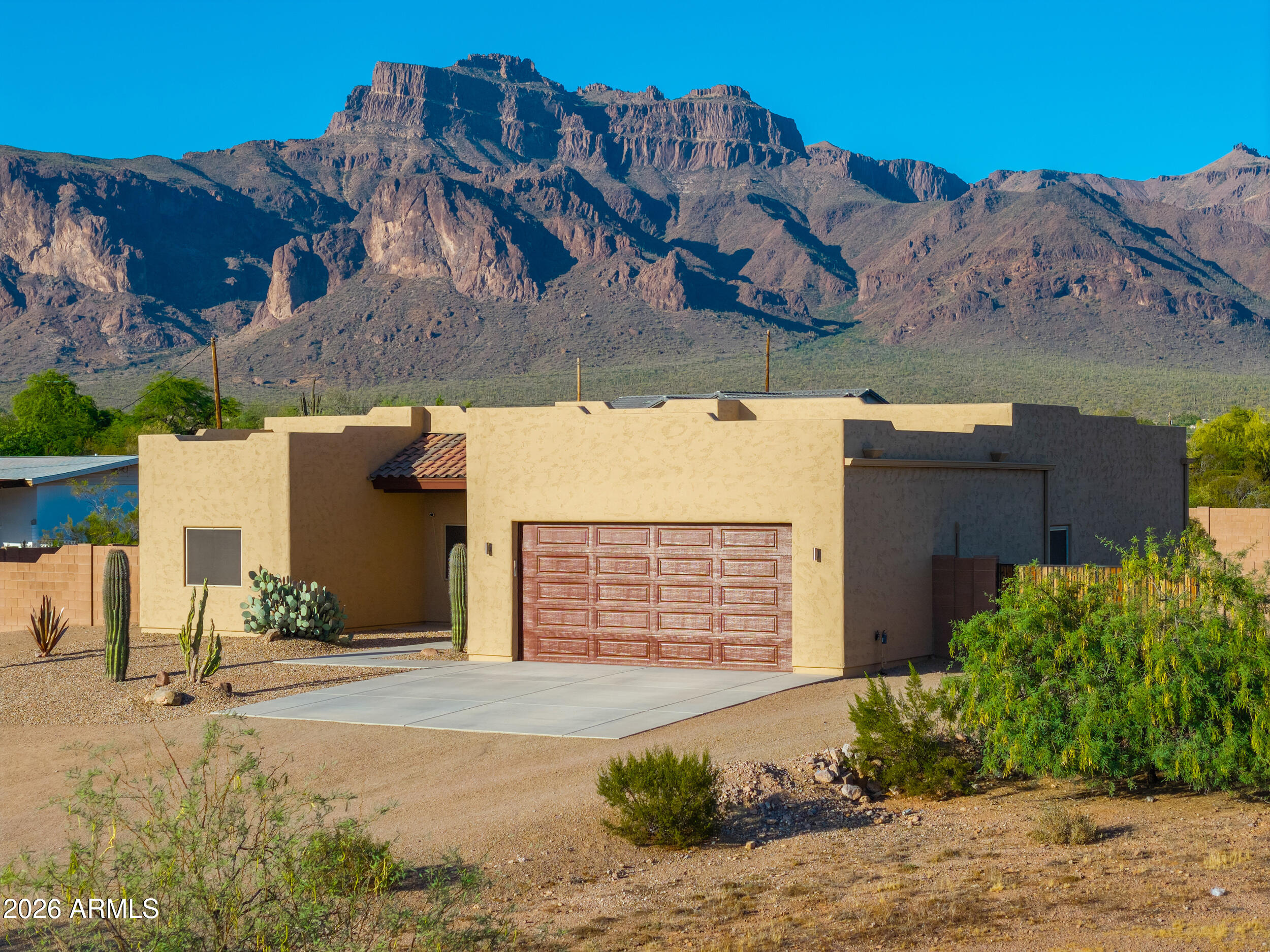 1487 South Mountain View Road Apache Junction, AZ 85119 - Photo 59 of 60 front view of a house with a yard