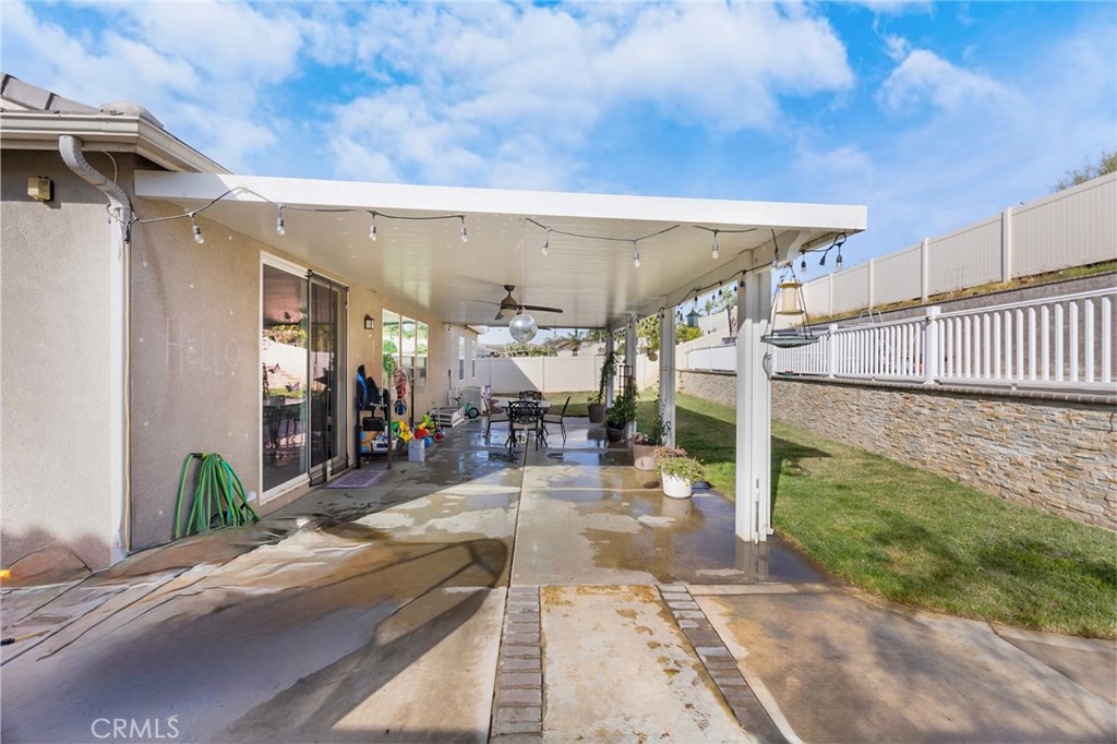 20668 Pitchfork Drive Riverside, CA 92507 - Photo 22 of 25 a view of a patio with table and chairs potted plants