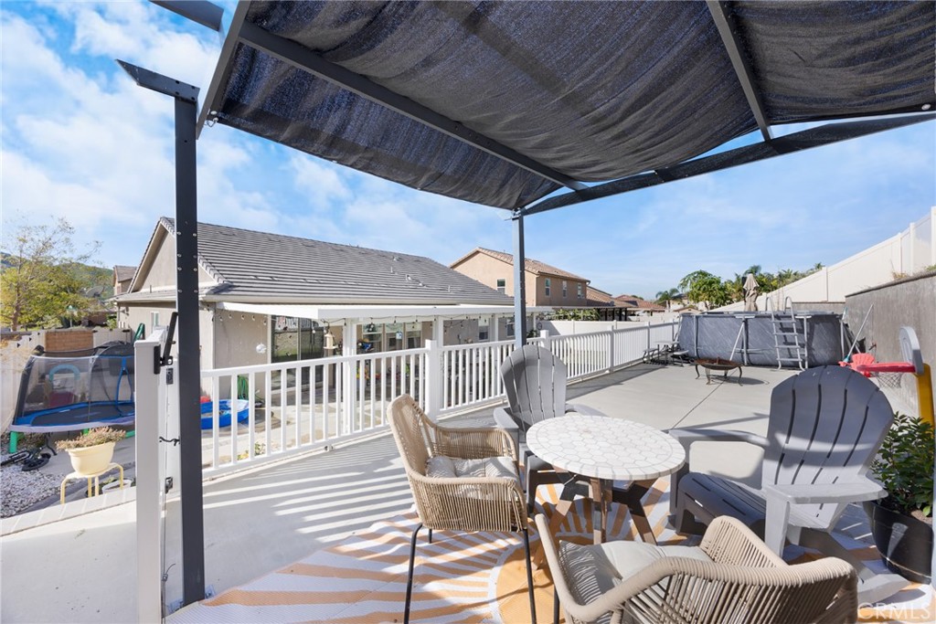 20668 Pitchfork Drive Riverside, CA 92507 - Photo 25 of 25 a view of a patio with a table chairs and barbeque