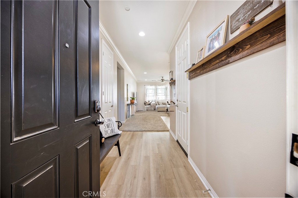 20668 Pitchfork Drive Riverside, CA 92507 - Photo 4 of 25 a view of a hallway with wooden floor and staircase