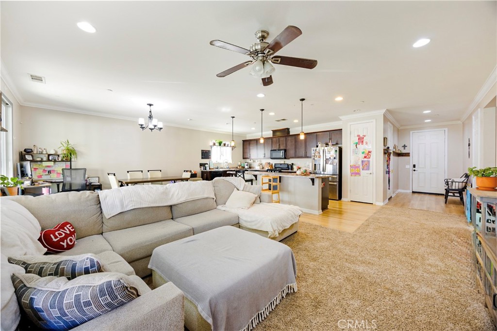 20668 Pitchfork Drive Riverside, CA 92507 - Photo 7 of 25 a living room with furniture and kitchen view