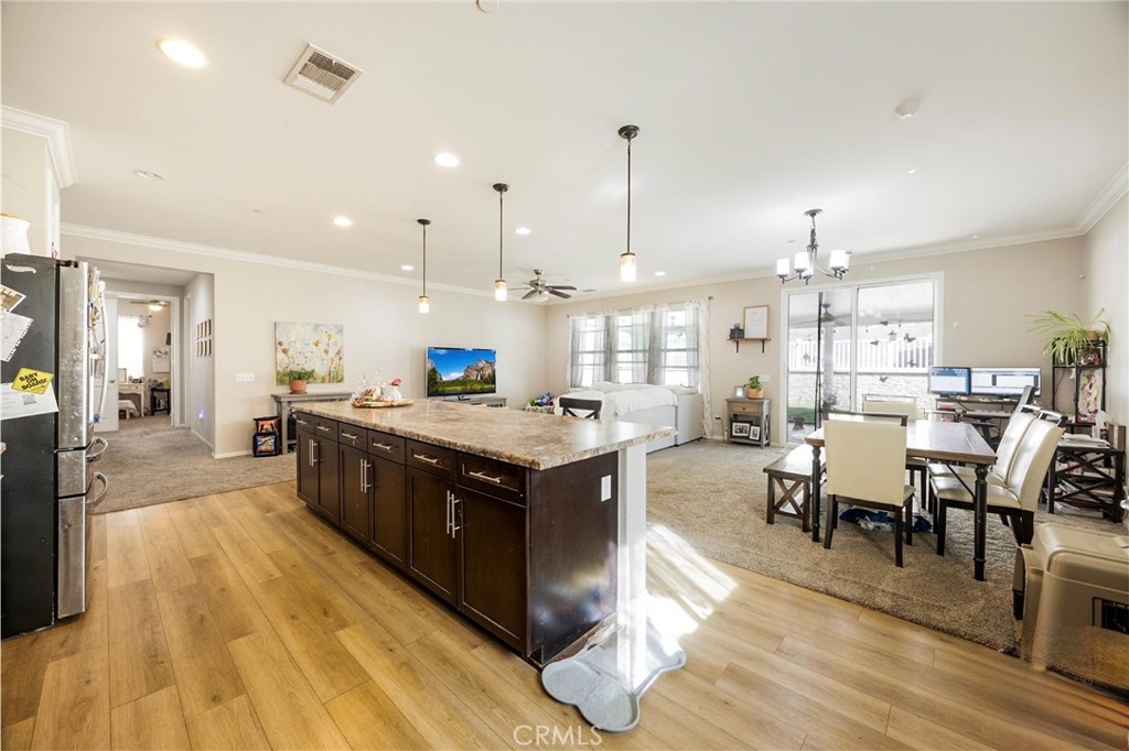 20668 Pitchfork Drive Riverside, CA 92507 - Photo 8 of 25 a large kitchen with stainless steel appliances lots of counter space and breakfast area