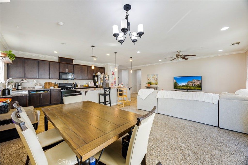 20668 Pitchfork Drive Riverside, CA 92507 - Photo 9 of 25 a living room with furniture kitchen and a chandelier