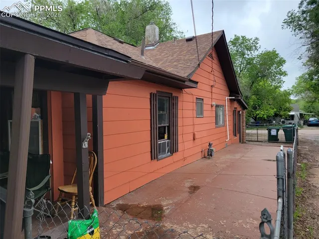 a backyard of a house with seating space