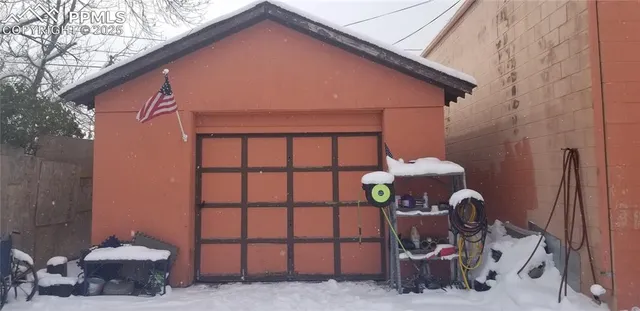a front view of a house with outdoor seating