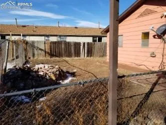 a view of a backyard of the house