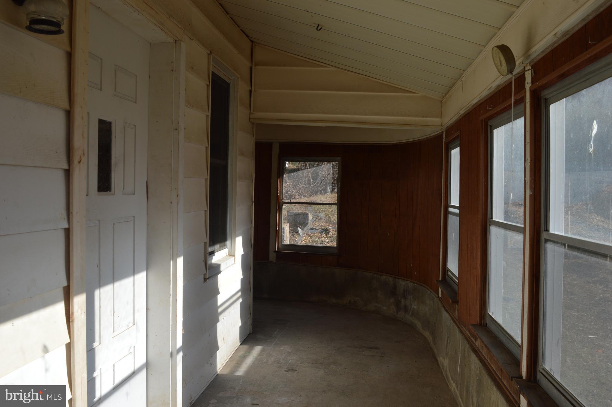 709 Pine Grove Road Bluemont, VA 20135 - Photo 19 of 23 Enclosed porch goes around to the kitchen