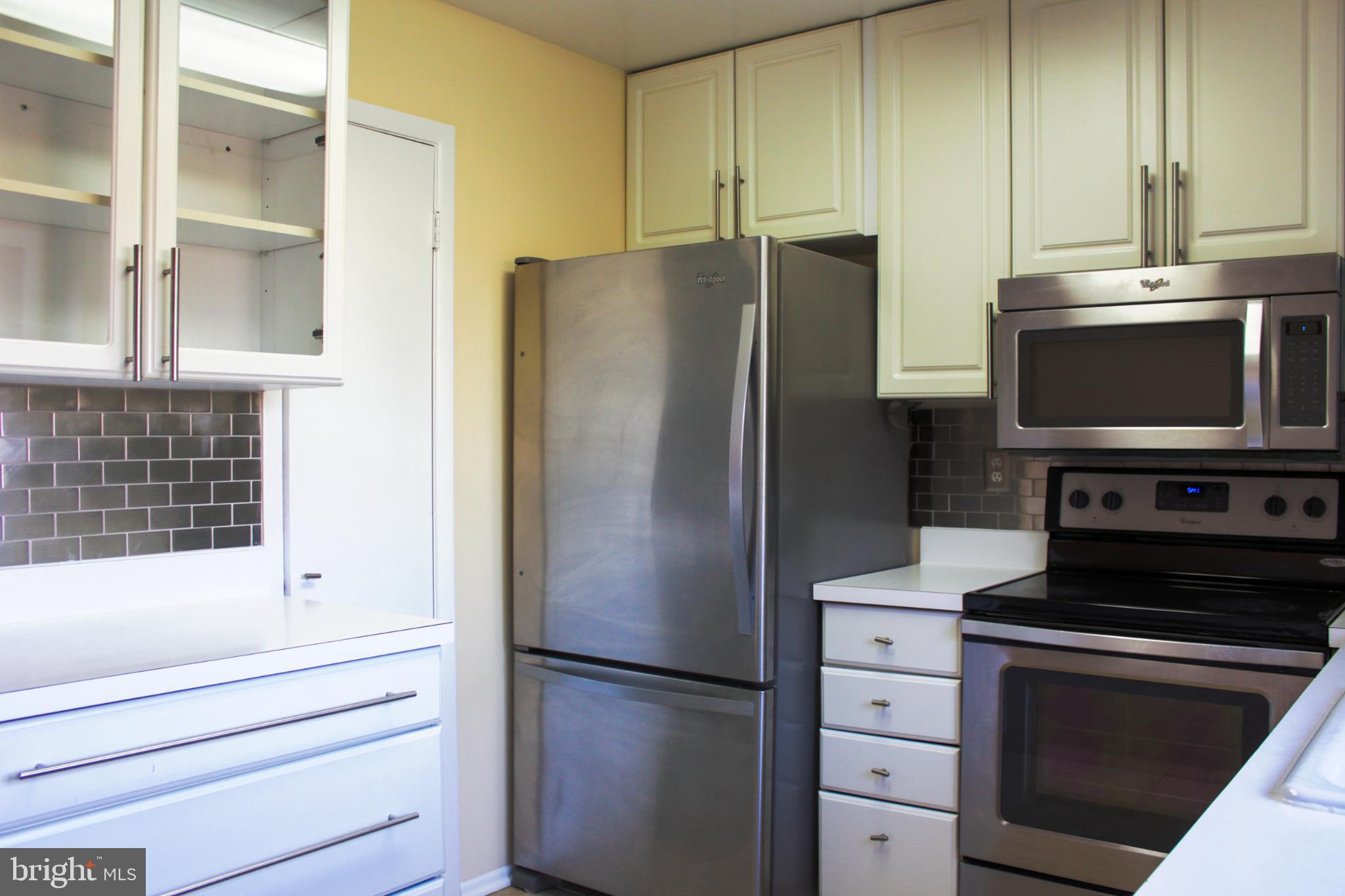 9040 Centerway Road Gaithersburg, MD 20879 - Photo 17 of 43 Modern kitchen with sleek appliances.