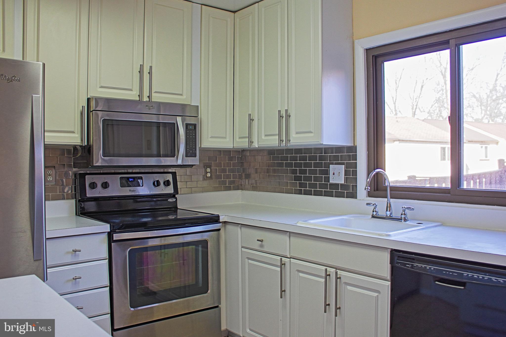 9040 Centerway Road Gaithersburg, MD 20879 - Photo 18 of 43 Modern kitchen with sleek finishes.