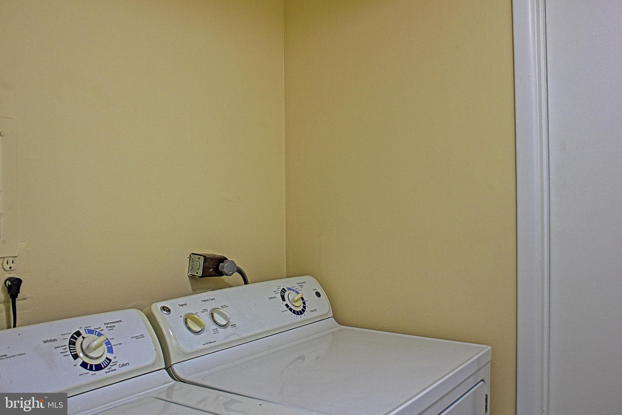9040 Centerway Road Gaithersburg, MD 20879 - Photo 21 of 43 Bright laundry space with washer and dryer