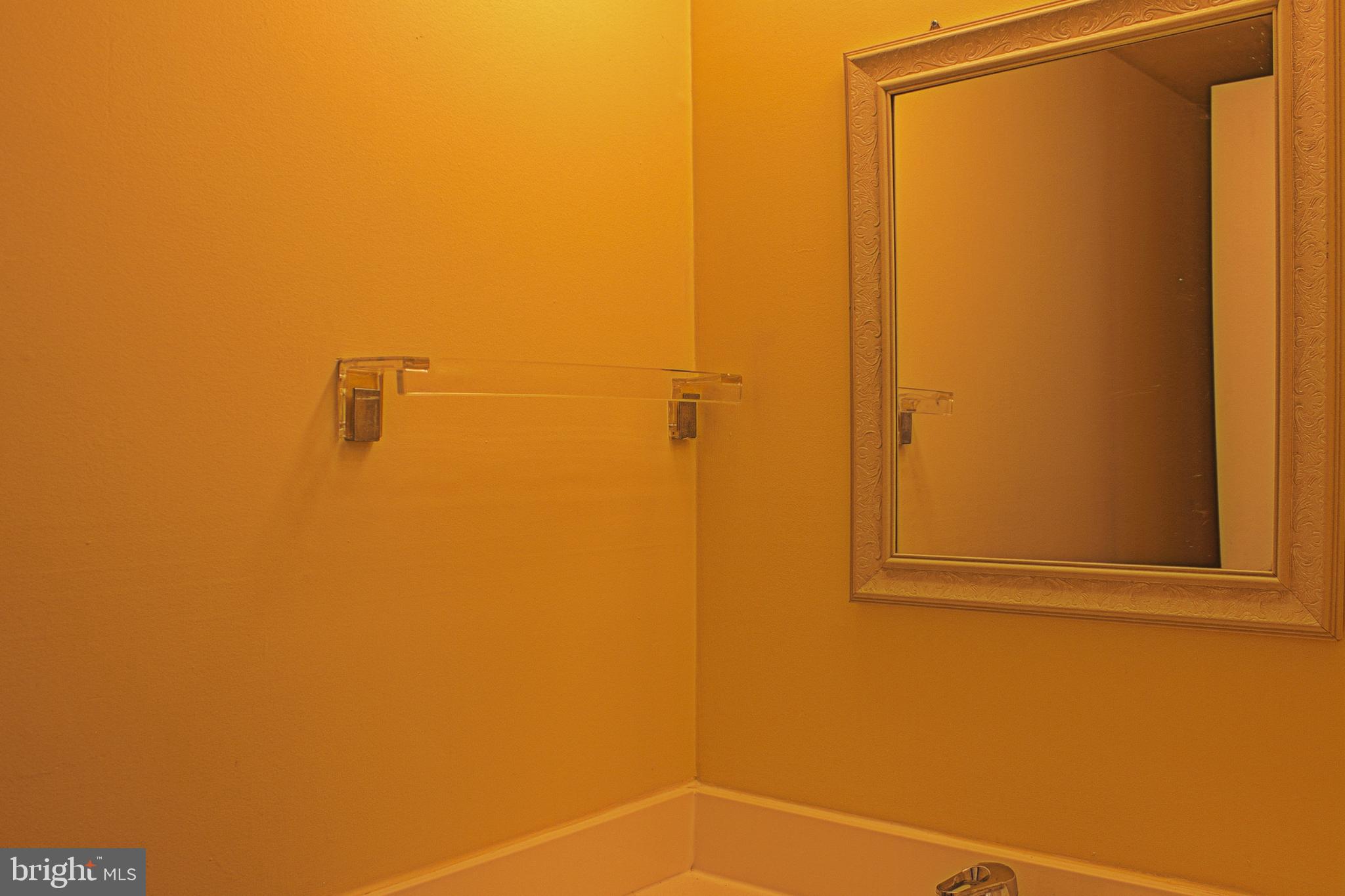 9040 Centerway Road Gaithersburg, MD 20879 - Photo 22 of 43 Warm-toned half bathroom on main floor.