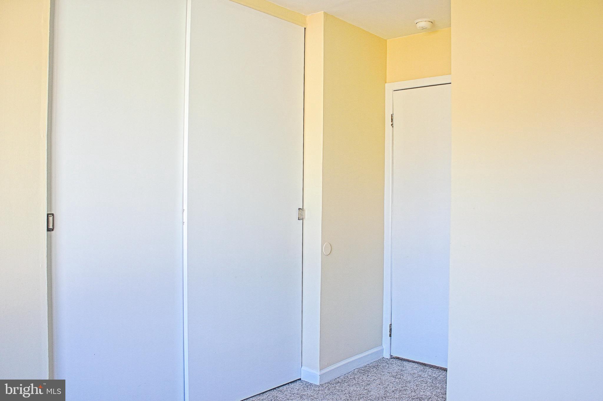 9040 Centerway Road Gaithersburg, MD 20879 - Photo 23 of 43 Bright and airy upstairs bedroom with sleek doors.