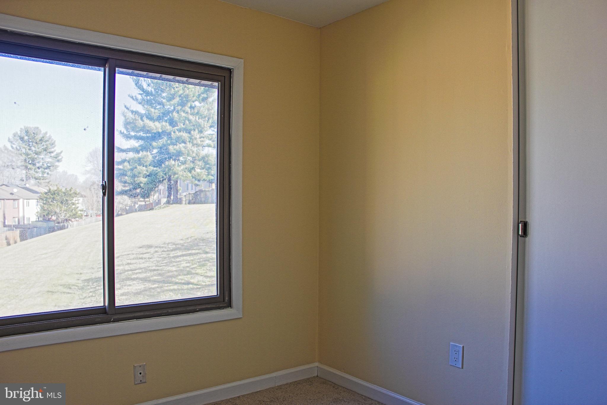 9040 Centerway Road Gaithersburg, MD 20879 - Photo 24 of 43 Bright corner with serene outdoor view.