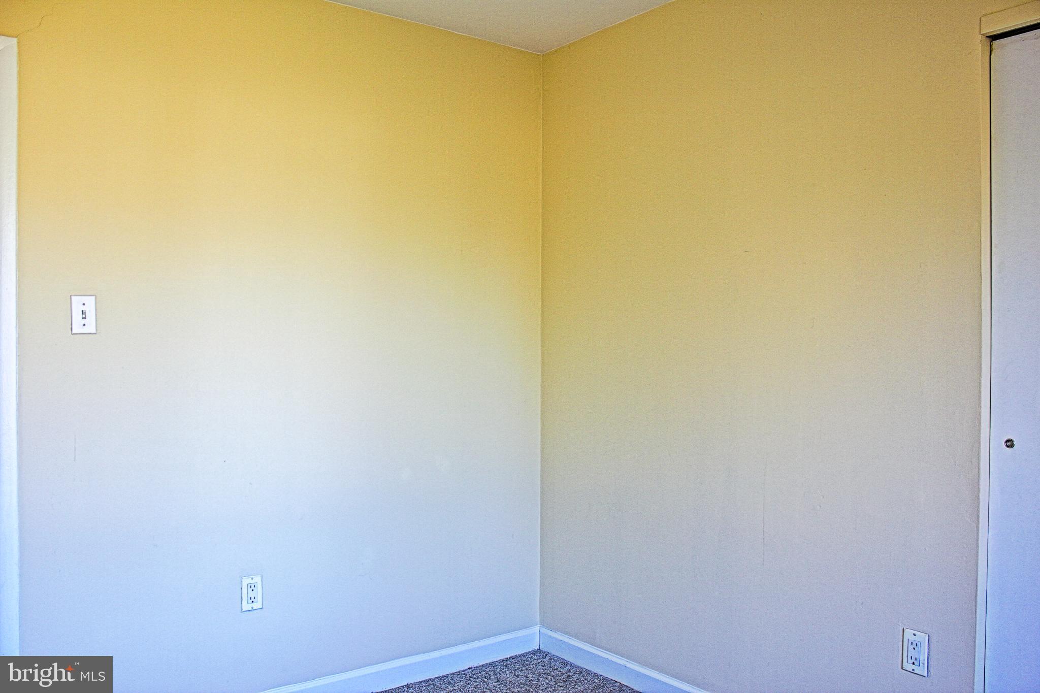 9040 Centerway Road Gaithersburg, MD 20879 - Photo 32 of 43 Bright wall of the second upstairs bedroom.