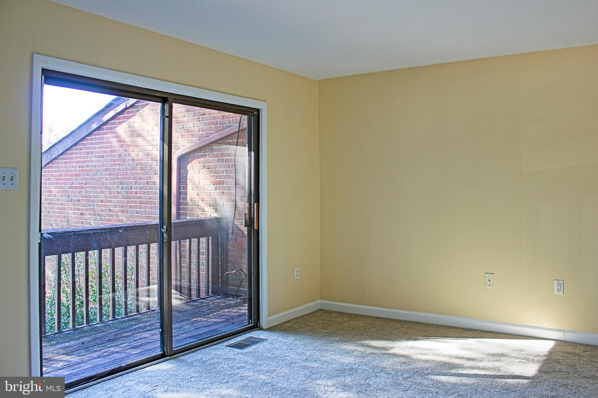 9040 Centerway Road Gaithersburg, MD 20879 - Photo 34 of 43 Bright main bedroom with balcony access.