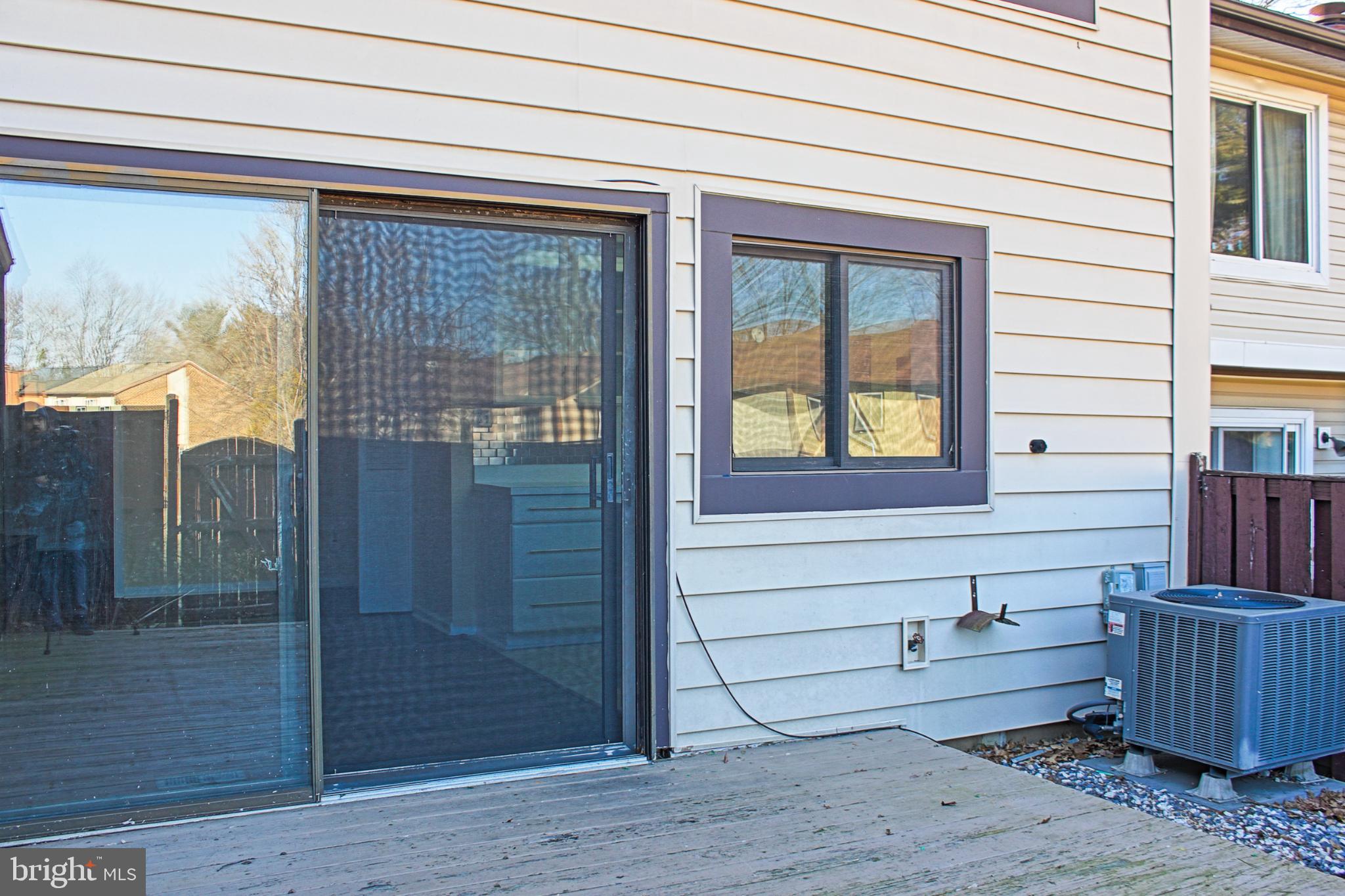 9040 Centerway Road Gaithersburg, MD 20879 - Photo 41 of 43 Inviting outdoor space with a wooden fence.