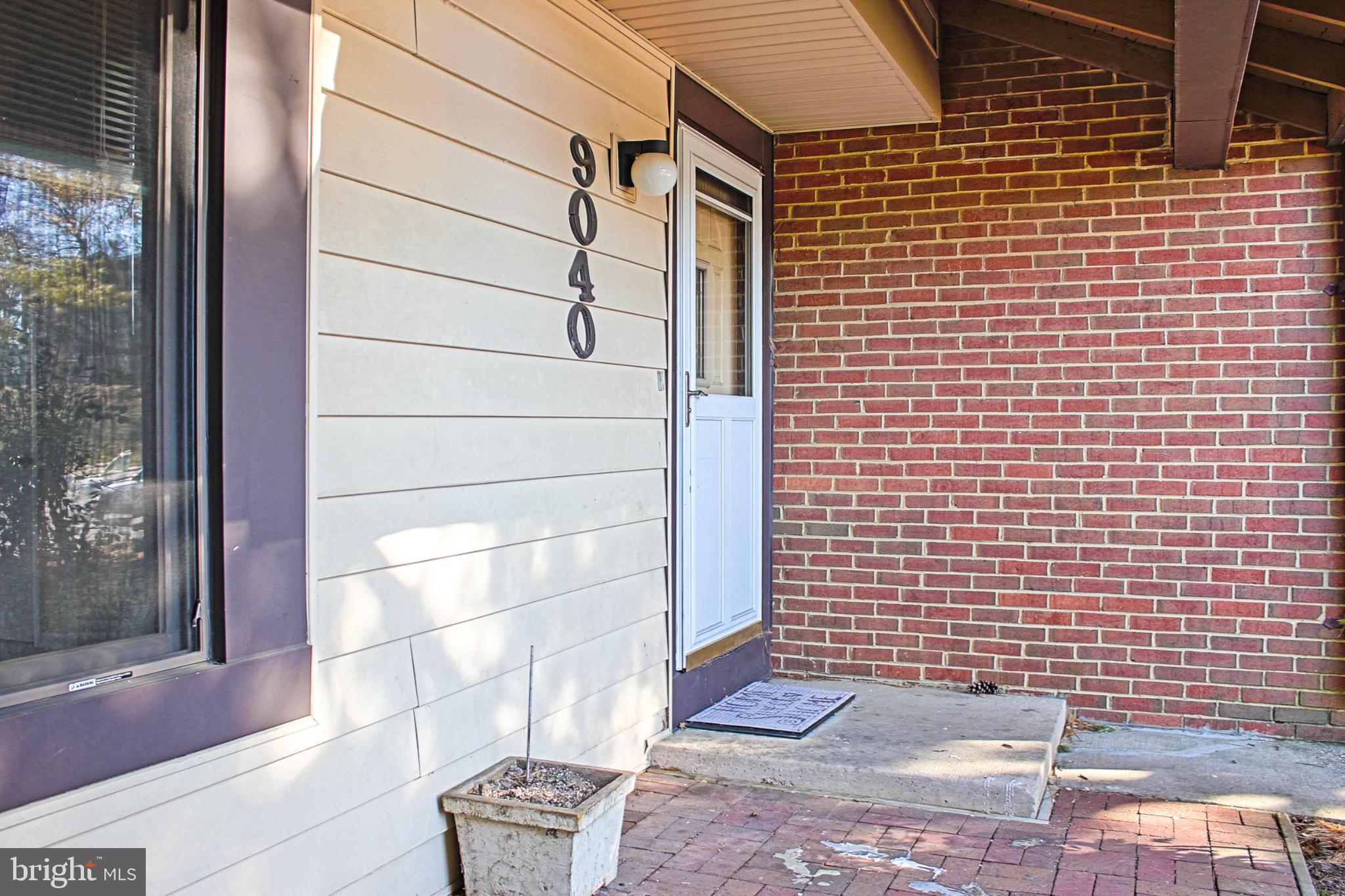9040 Centerway Road Gaithersburg, MD 20879 - Photo 5 of 43 Charming entryway with inviting brick accents.