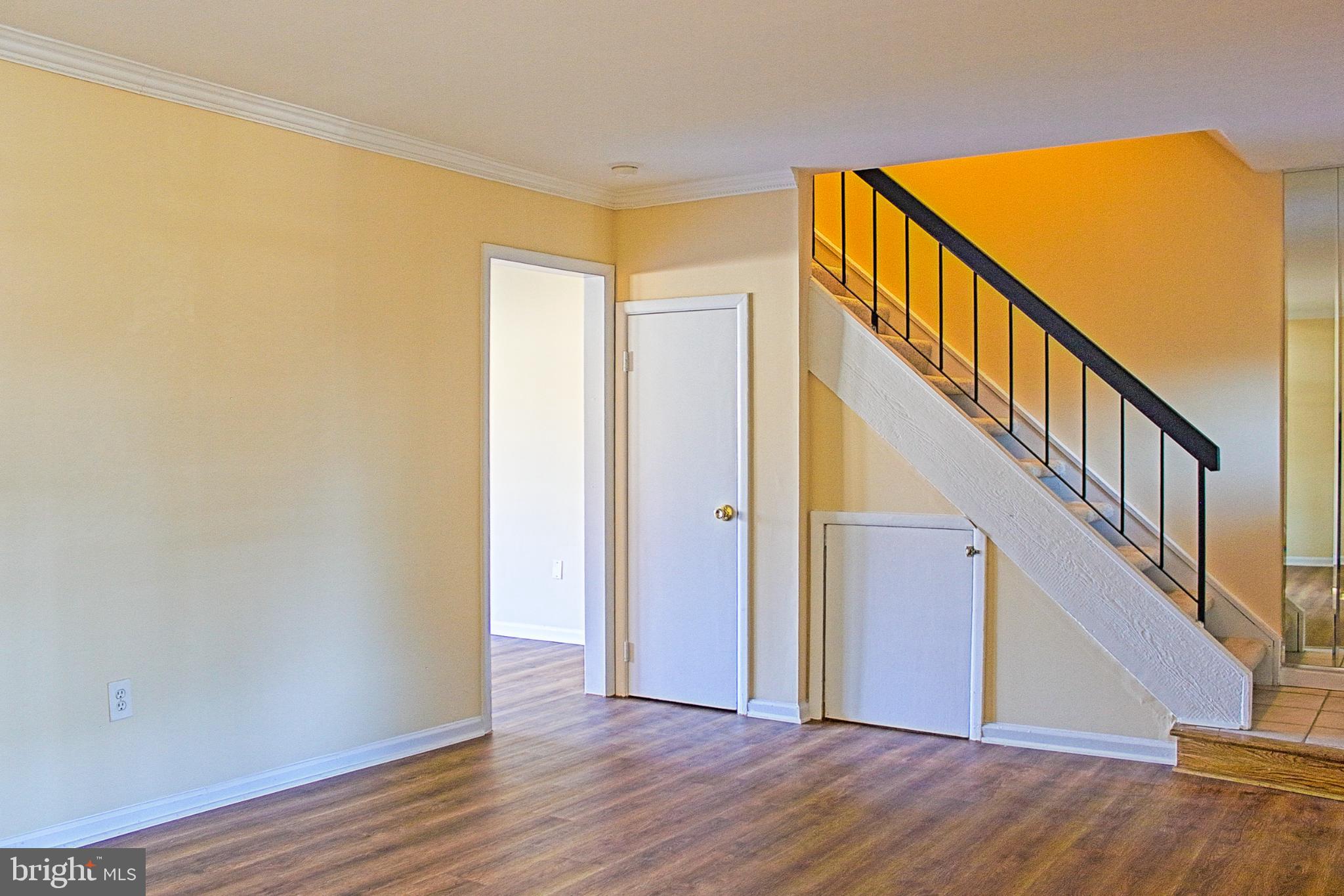 9040 Centerway Road Gaithersburg, MD 20879 - Photo 8 of 43 Bright and inviting entryway with stairs.