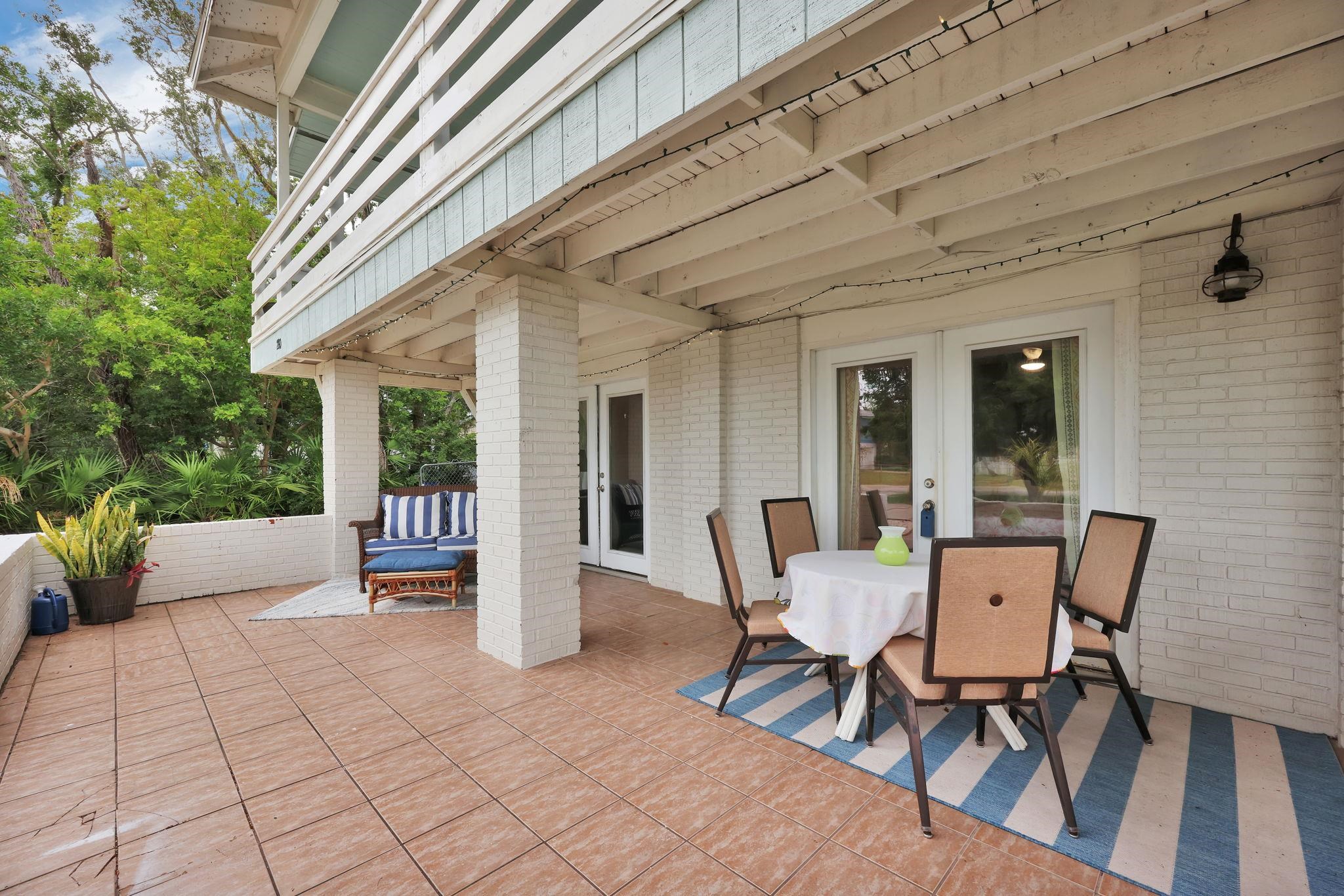 280 Majorca Road St. Augustine, FL 32080 - Photo 29 of 57 a view of a patio with table and chairs and potted plants