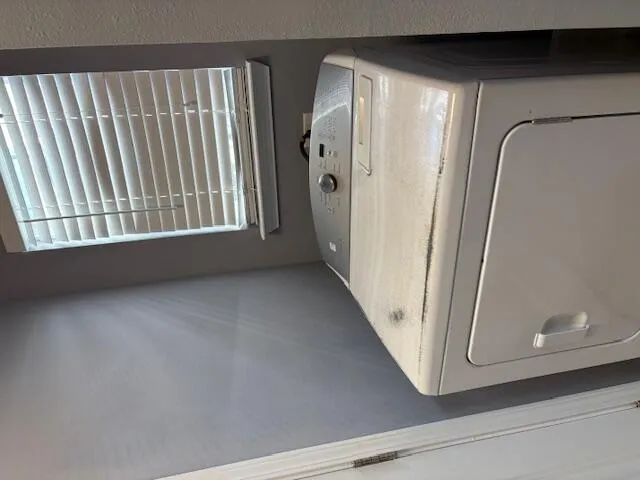 a view of a closet area with staircase