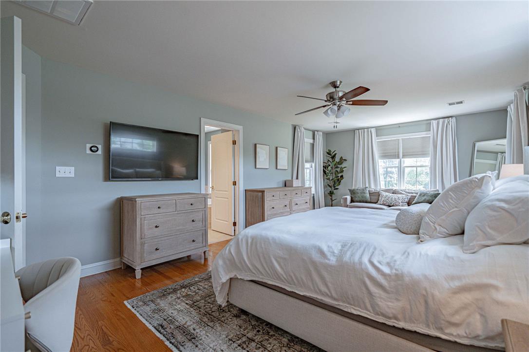 6000 Pond View Terrace Bath, PA 18014 - Photo 36 of 69 Hardwood floors and generous windows elevate this spacious, tranquil bedroom.